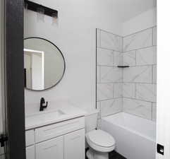 Full bathroom with vanity, toilet, and shower / bathtub combination