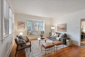 Living room with wood finished floors and baseboards