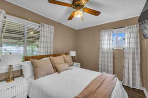 Bedroom with wood finished floors and ceiling fan