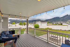 Deck with a mountain view and a residential view