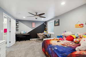 Carpeted bedroom featuring recessed lighting, a ceiling fan, baseboards, and connected bathroom