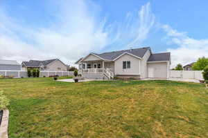 Back of house with an outdoor fire pit and a patio
