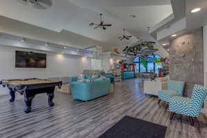 Game room with a ceiling fan, wood finished floors, billiards table, recessed lighting, and high vaulted ceiling