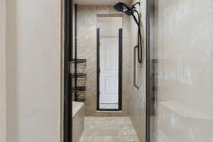 Bathroom featuring a shower stall