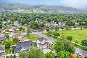 Aerial view of residential area featuring a mountainous background