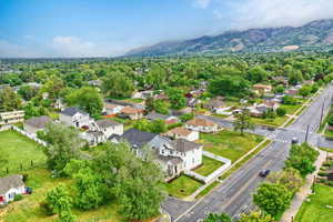 Aerial perspective of suburban area featuring a mountain backdrop