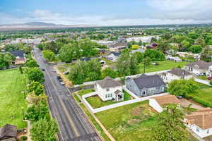 Aerial view of residential area featuring a mountainous background