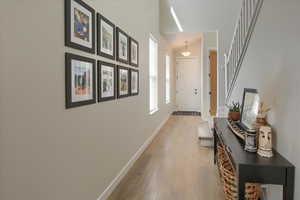 Hall featuring light wood-style floors and baseboards