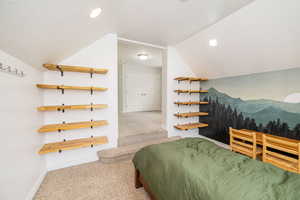 Bedroom featuring lofted ceiling, carpet flooring, baseboards, and recessed lighting