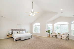 Bedroom with carpet flooring, baseboards, vaulted ceiling, a ceiling fan, and recessed lighting
