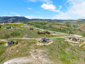 Overview of rural landscape featuring a mountainous background
