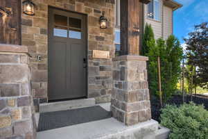 Property entrance with stone siding