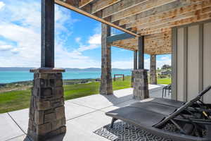 View of patio with a water view