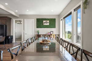 Dining space featuring recessed lighting, a chandelier, and wood finished floors