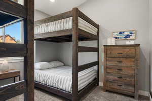 Carpeted bedroom with baseboards