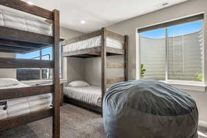 Carpeted bedroom featuring recessed lighting