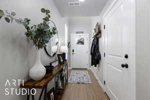 Entryway featuring wood finished floors and baseboards