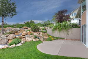 View of yard featuring a patio area and stairway