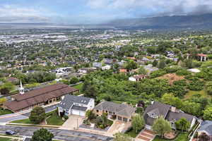 Aerial perspective of suburban area featuring a mountain backdrop