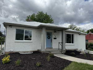 View of front of house featuring brick siding
