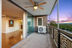 Balcony with a ceiling fan and a cooling unit