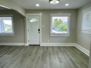 Living area, new paint, new vinyl LVP flooring, new windows and new lights