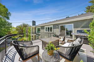 Wooden terrace with an outdoor living space