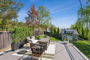 View of patio / terrace featuring an outdoor hangout area and an outbuilding