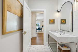 Bathroom with a sink and tile patterned flooring