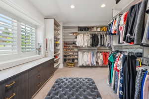 Walk in closet with carpet