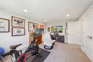 Workout room featuring recessed lighting, carpet flooring, and baseboards