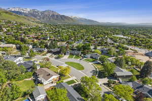 Aerial view of residential area featuring mountains