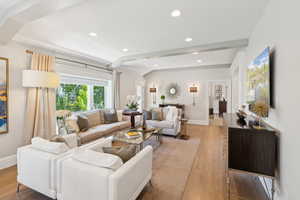 Living area with baseboards, light wood-style flooring, and recessed lighting