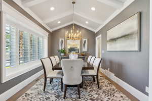 Dining space featuring wood finished floors, a chandelier, healthy amount of natural light, baseboards, and recessed lighting