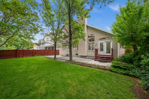 Rear view of house featuring a patio and stucco siding