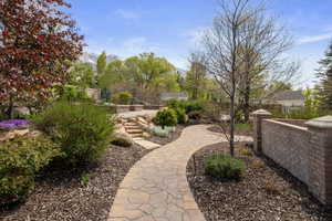 View of yard with a mountain view and fence