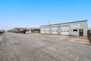 View of commercial property featuring a detached garage