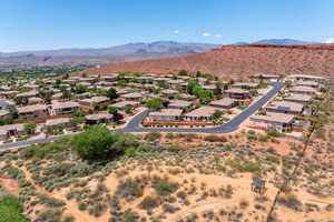 Aerial perspective of suburban area with a mountainous background