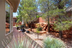 View of yard featuring fence