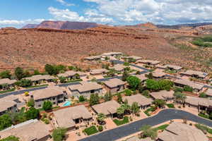 Aerial view of residential area featuring a mountainous background