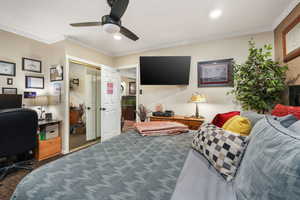 Carpeted office space featuring ceiling fan, ornamental molding, and recessed lighting