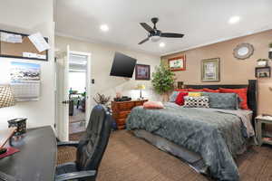 Bedroom featuring carpet floors, crown molding, recessed lighting, a desk, and a ceiling fan