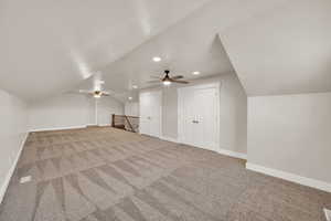 Bonus room featuring vaulted ceiling, recessed lighting, carpet floors, ceiling fan, and baseboards