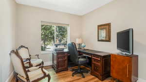 Office space with light wood finished floors and baseboards