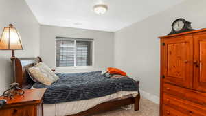 Carpeted bedroom with baseboards