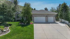 View of front of property with driveway, a garage, brick siding, and roof with shingles