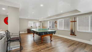 Game room featuring wood finished floors, baseboards, and recessed lighting
