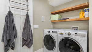 Laundry area featuring independent washer and dryer
