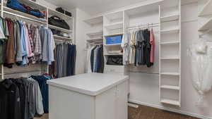 Spacious closet with carpet floors