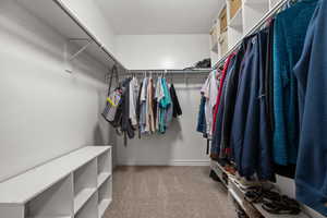 Walk in closet with carpet